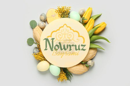 Foto de Greeting card for Novruz Bayram with flowers, eggs and sweets on light background - Imagen libre de derechos