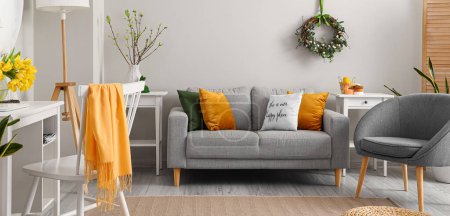 Photo for Interior of light living room decorated for Easter holiday - Royalty Free Image
