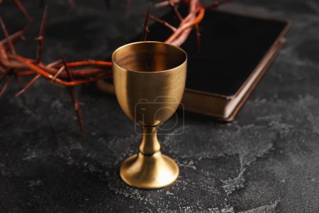 Photo for Wine cup, crown of thorns and Holy Bible on dark background, closeup - Royalty Free Image