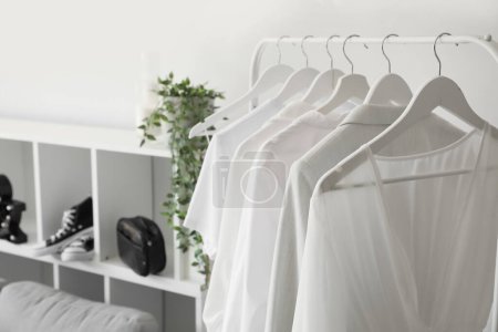 Photo for Rack with light clothes in makeup room, closeup - Royalty Free Image