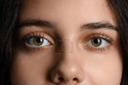 Teenage girl with green eyes, closeup