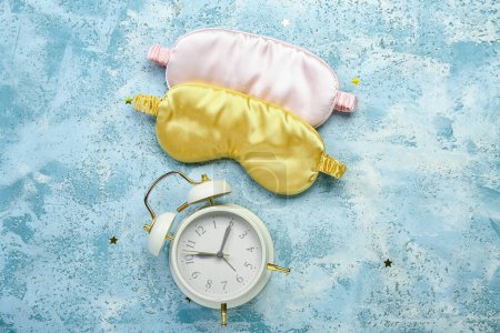 Photo for Sleeping masks and alarm clock on color background. World Sleep Day concept - Royalty Free Image
