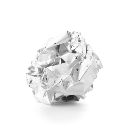 Crumpled ball of aluminium foil on white background