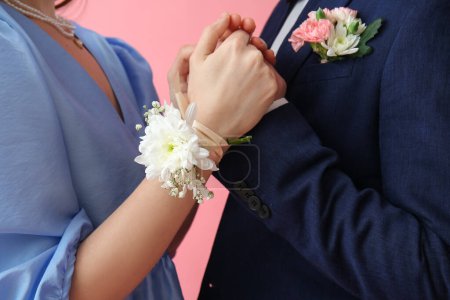 Photo for Young girl and her prom date on pink background, closeup - Royalty Free Image