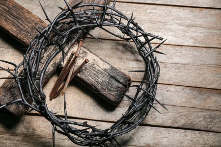 Photo for Crown of thorns with nails and cross on wooden background - Royalty Free Image