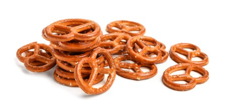 Heap of tasty pretzels isolated on white background