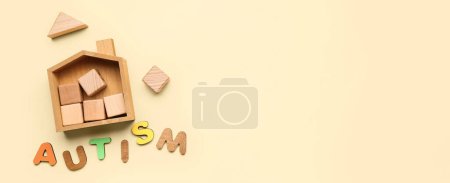Photo for Word AUTISM and toys on beige background with space for text - Royalty Free Image