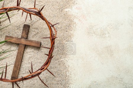 Photo for Wooden cross with crown of thorns and palm leaf on sand. Good Friday concept - Royalty Free Image