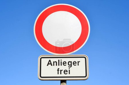 View of entry prohibited sign against blue sky, closeup