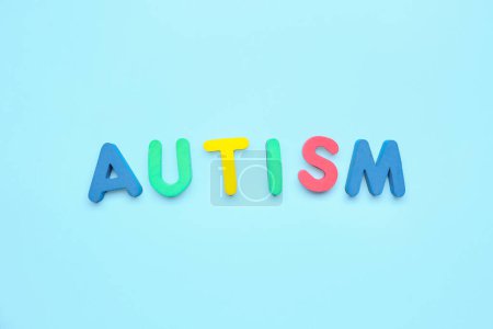Photo for Word AUTISM on blue background - Royalty Free Image