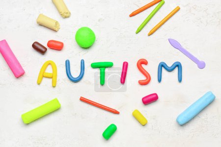 Photo for Word AUTISM with plasticine on white background - Royalty Free Image