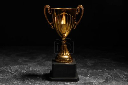 Photo for Gold cup on dark background - Royalty Free Image