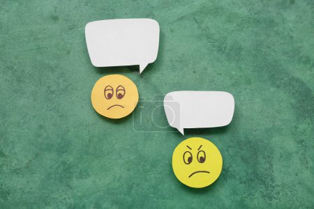Photo for Sad faces with speech bubbles on grunge background. Dialogue concept - Royalty Free Image