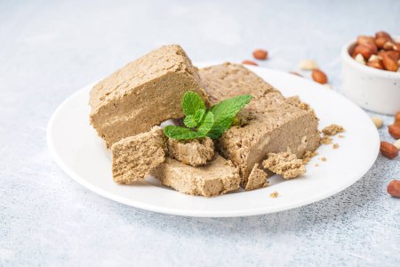 Photo for Plate with pieces of tasty halva on light background - Royalty Free Image