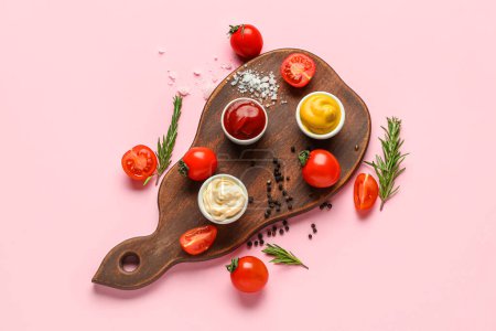Photo for Board with bowls of different sauces, vegetables and seasoning on pink background - Royalty Free Image