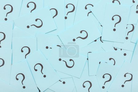 Photo for Blue papers with question marks as background - Royalty Free Image