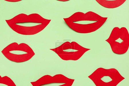 Photo for Red paper lips on green background - Royalty Free Image