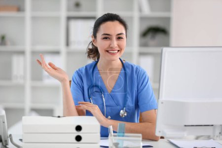 Photo for Female medical assistant at workplace in clinic - Royalty Free Image