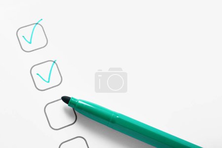 Photo for Checklist box with marks and green marker, closeup - Royalty Free Image