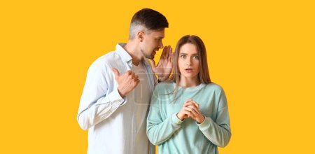 Photo for Gossiping people on yellow background - Royalty Free Image