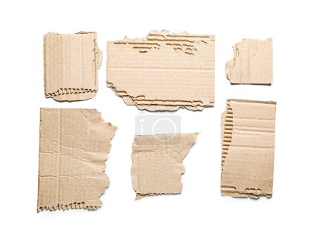 Ripped cardboard pieces isolated on white background
