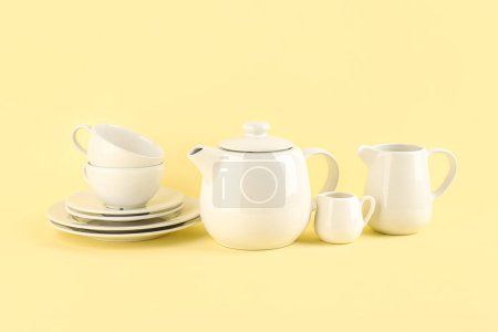 Photo for Stylish tea set on yellow background - Royalty Free Image