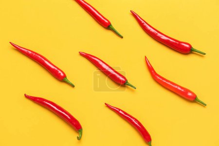 Photo for Fresh hot chili peppers on yellow background - Royalty Free Image