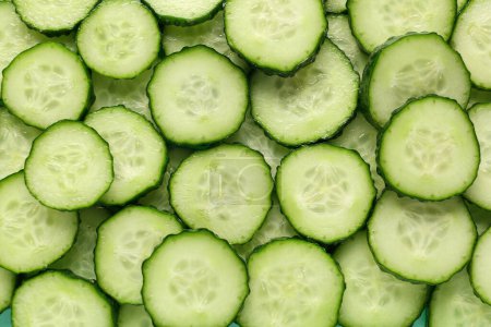 Photo for Texture of sliced cucumber as background - Royalty Free Image