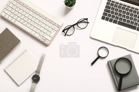 Photo for Composition with glasses, magnifiers, laptop and keyboard on white background - Royalty Free Image
