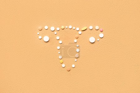 Photo for Uterus made of pills on beige background. Hormones concept - Royalty Free Image