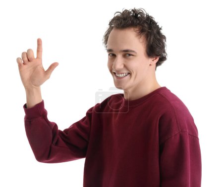Photo for Young man showing loser gesture on white background - Royalty Free Image
