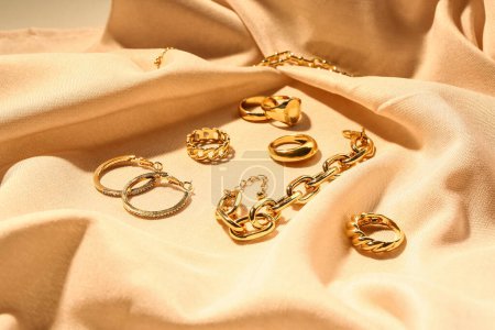 Beautiful jewellery on color fabric background