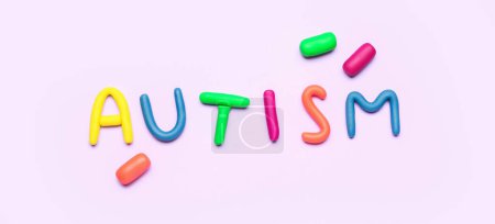 Photo for Word AUTISM made of plasticine on lilac background - Royalty Free Image