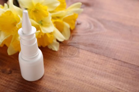 Photo for Nasal drops with flowers on wooden background, closeup. Seasonal allergy concept - Royalty Free Image