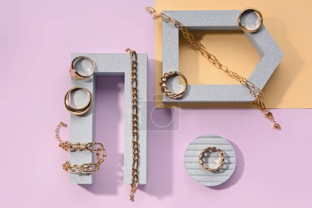 Showcase pedestals with golden rings and bracelets on color background Mouse Pad 657077854