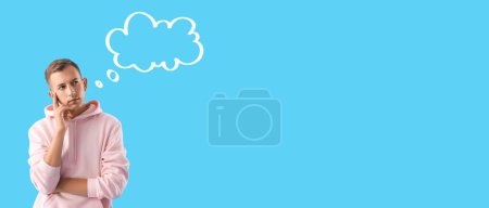 Photo for Thoughtful young man with blank speech bubble on light blue background with space for text - Royalty Free Image