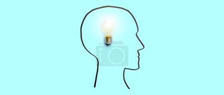Drawn human head with light bulb on light blue background. Concept of insight