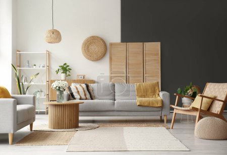 Photo for Interior of light living room with grey sofas, wooden armchair and coffee table - Royalty Free Image