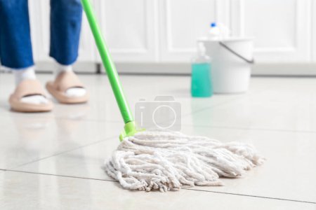 Photo for Woman mopping floor in room, closeup - Royalty Free Image