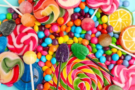 Sweet lollipops and candies as background, closeup