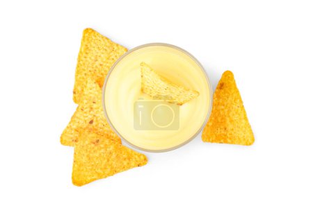 Photo for Bowl with tasty cheddar cheese sauce and nachos on white background - Royalty Free Image