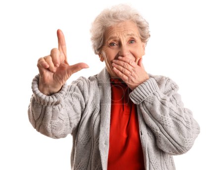 Photo for Senior woman showing loser gesture on white background - Royalty Free Image