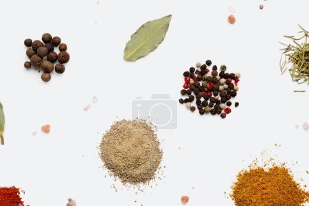 Photo for Heaps of aromatic spices on light background - Royalty Free Image