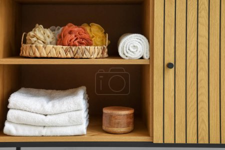 Photo for Chest of drawers with bath accessories in room - Royalty Free Image