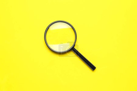 Photo for Black magnifiers on yellow background - Royalty Free Image