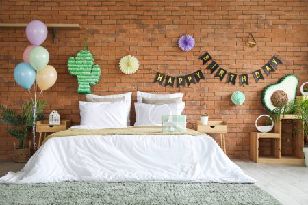 Photo for Interior of bedroom decorated for birthday with pinatas, balloons and garland - Royalty Free Image