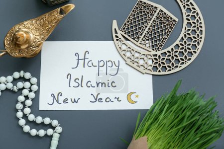 Photo for Card with text HAPPY ISLAMIC NEW YEAR, tasbih, Aladdin lamp and crescent on color background - Royalty Free Image