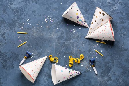 Photo for Frame made of party hats, whistles, candles and confetti on color background - Royalty Free Image