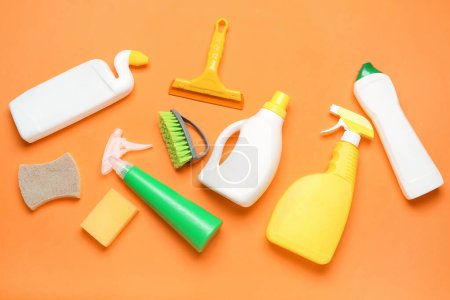 Photo for Different cleaning supplies on orange background - Royalty Free Image