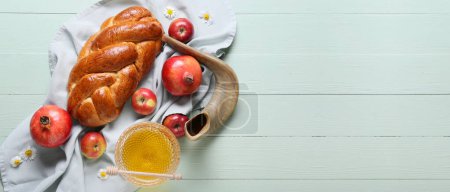 Composition for Rosh Hashanah (Jewish New Year) celebration on wooden background with space for text